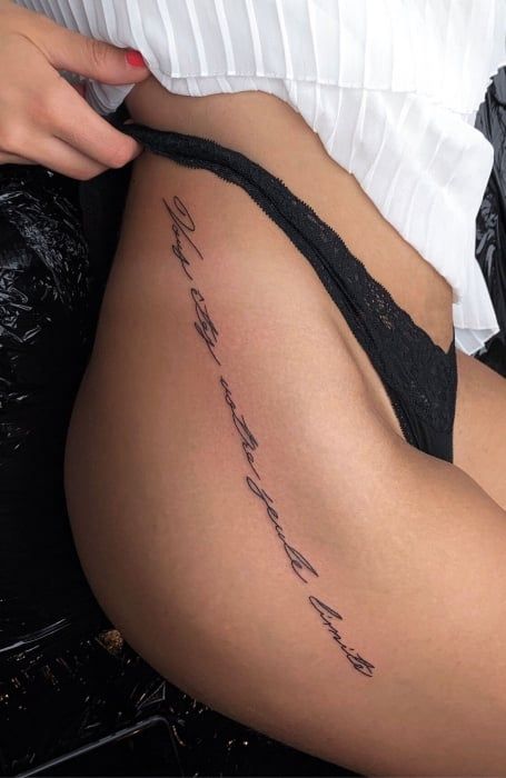 50 Sexy Hip Tattoos for Women (2023) - The Trend Spotter Words Down Hip Tattoo, Quote Hip Tattoo, Cursive Thigh Tattoo, Side Hip Tattoos Women Quotes, Hip Quote Tattoo, Cursive Tattoos For Women, Thigh Quote Tattoo, Hips Tattoo, Hip Tattoo Quotes