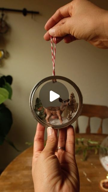 Sibia Torres Padilla | DIYs on Instagram: "This will has been one of my favorite “use what you have” ways to make a Christmas ornament  I simply took the ring from a mason lid and measured two circles the same size from some used plastic. You can use spinach containers, berry containers, etc..  I glued one plastic circle inside the mason jar then I glued my small decorations to the inside of the mason jar ring  and then I added the second circle to close it up, but before doing that, I left a small opening to add some Epson salt as snow  then I glued a little handle to the back and our ornament was complete   let me know what you think of this DIY Christmas craft made from upcycled materials and if you have any questions, let me know in the comments" Mason Jar Lid Wreath, Snowglobe Ornament Diy, Bone Art Diy, Plastic Ornament Crafts, Berry Containers, Make A Christmas Ornament, Mason Jar Lids Crafts, Jar Lid Crafts, Memory Ornaments