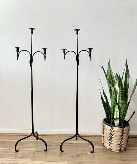 Vintage wrought iron candelabra of substantial size and scale. Beautifully made, with 3 candle-holding platorms. Two are available, price is per one candelabra. DIMENSIONS 14ʺW × 14ʺD × 54ʺH Good vintage condition. No structural issues. Wrought Iron Candle Stands, Candelabra Decor, Floor Candelabra, Black Candelabra, Cast Iron Candle Holder, Long Candles, Floor Candle Holders, Wrought Iron Candle, Tall Candle Holders