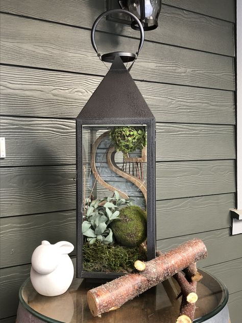 Rustic spring lantern Plants In Lanterns Decor, Large Latern Ideas, Lantern Box Ideas, Plants In Lanterns, How To Style Lanterns, Decorating With Lanterns Outdoors, Beachy Lanterns, Metal Lantern Decor Ideas, Porch Lantern Decor Ideas