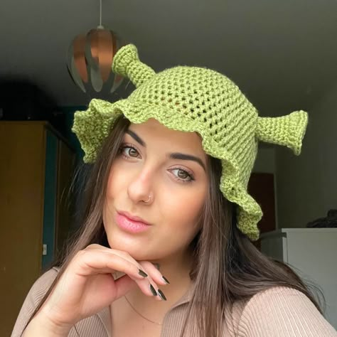 Handmade green crochet Shrek Hat! I made this originally for myself for a funny hat party, and it went a bit crazy on Instagram stories so I've added it to my site for you all to buy! If you love Shrek then this is the perfect little green bucket hat for you - perfect for fancy dress Fiona or Shrek looks and complete with frilled edges so you'll still look 10/10 cute. Choose between 3 Shrek-ky shades of green! I would recommend regular for most people as they are quite stretchy, but if you have quite a large head and/or curly hair that's quite full then I'd go for a large. It's impossible to make these without smiling, I hope you love them as much as I do! <3 Shrek Trunk Or Treat, Crochet Shrek Hat, Boyfriend Crochet, Crochet Shrek, Shrek Hat, Green Bucket Hat, Crocheted Stuff, Hat Party, Crazy Hats