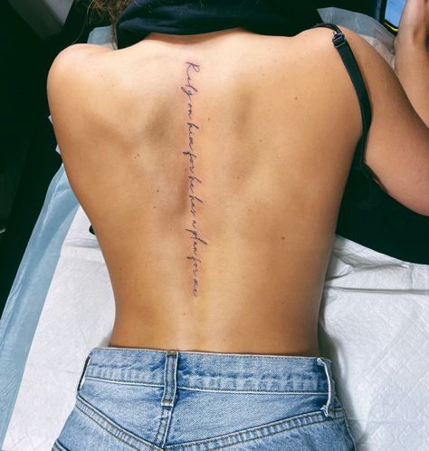 Lady Spine Tattoo, Fine Line Tattoo Down Spine, Text Spine Tattoo, Quote Tattoo On Spine, Proverbs 31 25 Spine Tattoo, Spine Verse Tattoo, Spine Tattoos For Women About Strength, Symbolic Spine Tattoo, Spine Cursive Tattoos For Women