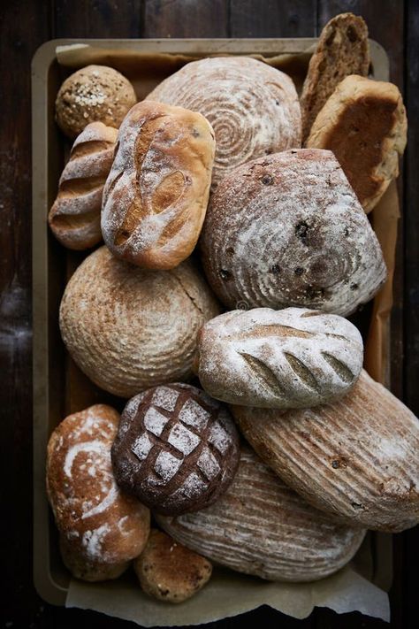 Some breads and rolls are piled on a plate in a wooden crate stock photo Artisan Bread Aesthetic, Bread Asethic, Bread Baking Aesthetic, Homemade Bread Aesthetic, Bread Making Aesthetic, Boulangerie Aesthetic, Breads And Rolls, Bread Aesthetic, Bread Photography