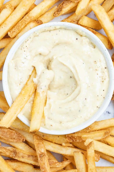 Ultra rich and creamy, this blended roasted garlic aioli will be your new favorite homemade condiment. Made with roasted garlic, dijon, parmesan, and a splash of lemon juice makes it perfect on top of your favorite sandwich or burger and great to dunk french fries into. #aiolirecipe #condiment #roastedgarlic #homemadeaioli #homemadesauce #homemademayo Lemon Garlic Aioli, Garlic Aioli Recipe, Homemade Aioli, Roasted Garlic Aioli, Alfredo Sauce Recipe Homemade, Salad Jar Recipe, Mason Jar Salad Recipes, Aioli Recipe, Homemade Condiments