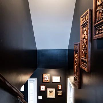 75 Foyer with Black Walls Ideas You'll Love - August, 2023 | Houzz Black Walls In Hallway, Black Accent Wall Stairway, Black Accent Wall Stairwell, Black Walls Staircase, Black Stair Wall Ideas, Black Wall Staircase, Dark Painted Staircase Walls, Black Stairwell Wall, Dark Gray Accent Wall Stairs