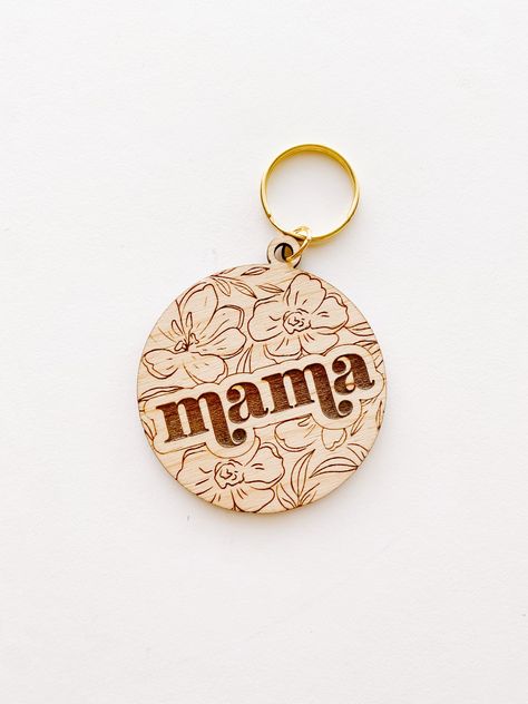 Floral Circle with Mama. Wood keychain. 4” long with gold key ring Production time: 1 week Wood Laser Keychain, Wood Engraved Keychain, Laser Wood Engraving Ideas, Keychain Wood Ideas, Engraved Leather Keychain, Laser Product Ideas, Cute Laser Cut Ideas, Wood Keychain Design, Wood Key Chain