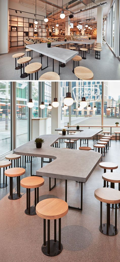 This modern cafe features a a snake-like, concrete shared table along the facade. #CafeDesign #TableDesign #CafeTable #CoffeeShop #CommunalTable Contemporary Cafe, Café Design, Communal Table, Modern Cafe, Coffee Shops Interior, Coffee Shop Design, Tables And Chairs, Table Cafe, Cafe Interior Design