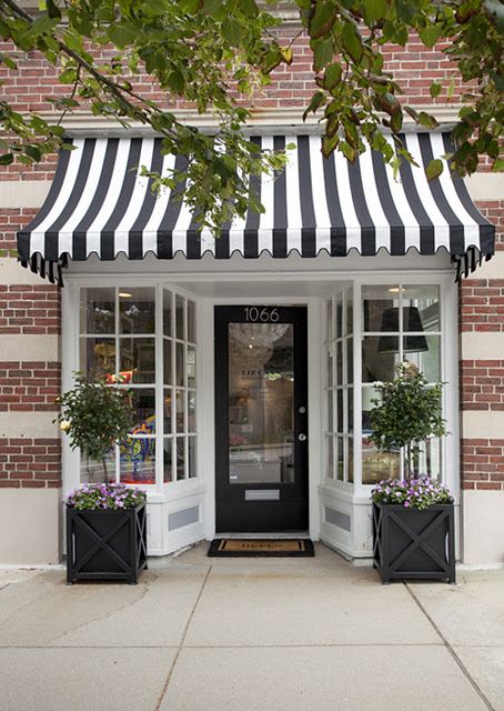 black and white striped awning. Striped Awning, Front Door Planters, Café Design, Nail Salon Design, Bakery Design, Shop Fronts, Shop Front Design, Shop Front, Store Front