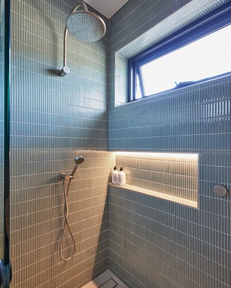 Ricky & Haydn's coastal-inspired main bathroom 💙 While the judges were unsure about the conflicting blue tones and many linear elements in this room, they all praised the boys for delivering this space...especially as they were a man down while Haydn rushed off to welcome his baby daughter into the world 👶 The boys chose our Tile of The Year, Pompeii Cenere 600x1200 and our Fire Fingers Sage Gloss mosaic ✨ What do you think of this space? Blue Finger Tiles Bathroom, Bathroom Finger Tiles, Finger Tiles Bathroom, Blue Cloakroom, Finger Tiles, Blue Fingers, Baby Daughter, Tiles Bathroom, Man Down