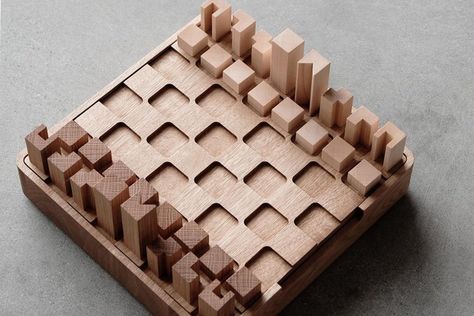 With such a classic — instantly recognizable design – how does one reimagine the visual aesthetic of a chessboard? There are chess piece sets modeled... Minimalist Chess Pieces, Minimalist Chess Set, Chess Design, Chess Boards, Wooden Board Games, Chess Table, Wood Chess, Game Collection, Wooden Chess