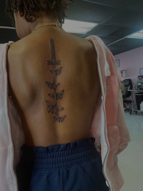 Knife Back Tattoo Women, Spine Tattoos Butterfly, Butterfly Tattoo Down The Spine, Knife Spine Tattoo, Spine Butterfly Tattoo, Spine Tattoos For Women With Butterflies, Spine Tattoos For Women Butterflies, Spinal Tattoo With Butterflies, Butterfly Back Tattoo Spine With Words