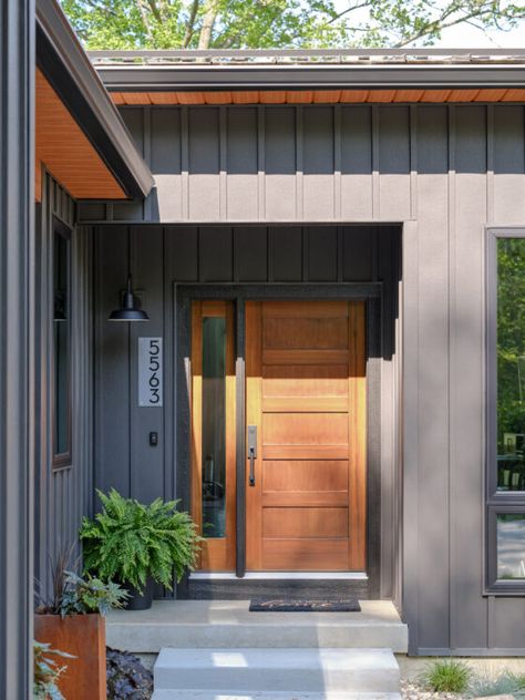 Black Bat And Board Siding, Wood And Metal Siding Exterior, Metal And Wood Siding House, Metal And Wood Siding, Board Batten Siding Exterior, Board And Batten Modern Exterior, Lake House Siding Colors, Ironstone Siding Exterior, Dark Grey Homes