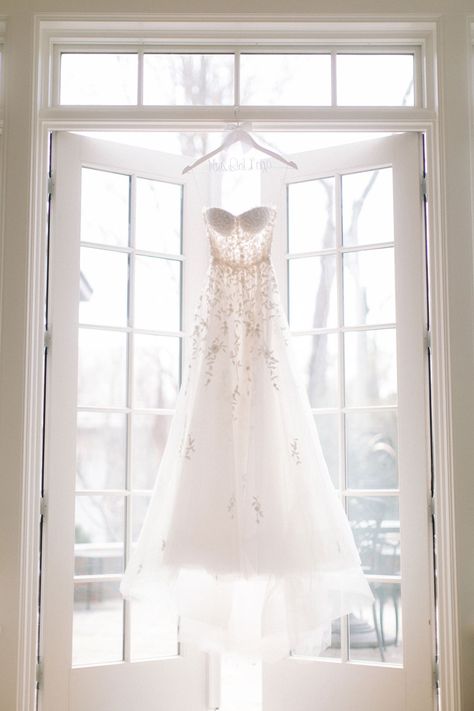 reem-acra-wedding-dress-strapless-personalized-hanger-hanging-in-window-french-doors-sunlight Hanging Wedding Dress, Wedding Dress Hanging, Wedding Photo List, Wedding Day Dresses, Wedding Dress Photoshoot, Wedding Dress Photography, Wedding Photography Checklist, Wedding Portrait Poses, White Weddings