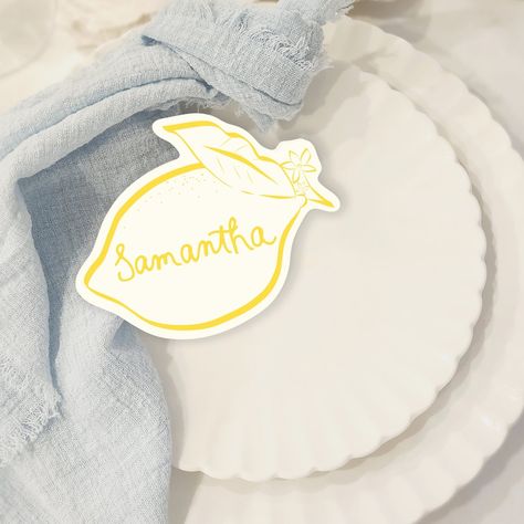 Add a touch of zest to your bridal shower with our lemon placecards! 🍋 Perfect for a lemon-themed celebration, these unique and fresh designs bring the charm of the Amalfi Coast to your special day. Let your "main squeeze" feel the love with every detail, making a vibrant statement that guests will remember! . . . . . #LemonPlacecards #BridalShowerDecor #MainSqueeze #AmalfiCoastVibes #MediterraneanStyle #LemonTheme #BridalShowerIdeas #FreshAndUnique #WeddingInspiration #BridalInspo #LemonLove... Amalfi Wedding Invitation, Lemon Wedding Decor, Creative Place Cards Wedding, Wedding Name Place Cards, Bridal Shower Place Cards, Mediterranean Table, Table Name Card, Place Cards Template, Place Card Table