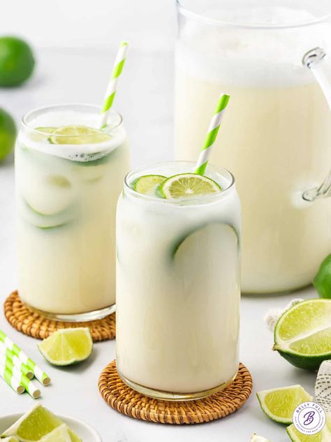 Made with fresh lime juice, lime zest, and sweetened condensed milk, Brazilian Lemonade is a rich, luscious, and super refreshing family-friendly drink. Perfect for hot summer days! Brazilian Lemonade, Limeade Recipe, Lime Drinks, Lemonade Cocktail, Dessert Dips, Lemonade Recipes, Lime Zest, Strawberry Lemonade, Sweetened Condensed Milk