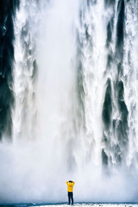 Skógafoss dwarfs a tourist in Iceland. Printed on C Type Fuji Matt archival photographic paper, this fine art print ensures exceptional quality and longevity, preserving the vibrant colours and details. Iceland Photo Ideas, Skogafoss Iceland, Iceland Travel Photography, Waterfall Iceland, Vision Boarding, Iceland Vacation, London Travel Poster, Skogafoss Waterfall, Waterfall Wall Art