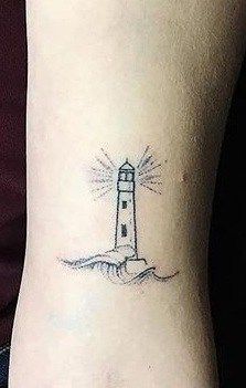 Lighthouse Tattoo Meaning, Lighthouse Tattoos, Anniversary Tattoo, Around Arm Tattoo, Unique Tattoos For Men, Stunning Tattoos, Lady Bug Tattoo, Lighthouse Tattoo, Tattoo Meanings