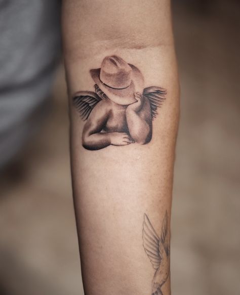 Cowboy Hat With Hearts Tattoo, Tattoo Cover Up Words, Cowboy Angel Tattoo, Cowboys And Angels Tattoo, Western Butterfly Tattoo, Western Forearm Tattoo Women, Southern Tattoos For Women, Palm Sized Tattoos, Western Tats