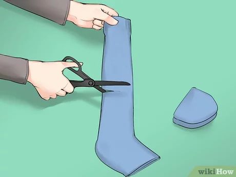 How to Sew a Sock Dog (with Pictures) - wikiHow Dog Sweater From Sock, Dog Toys From Socks, Sock Dog Pattern, Diy Dog Socks, Dog Boots Diy, Sock Dog, Dog Winter Boots, Dog Slippers, Paws Socks