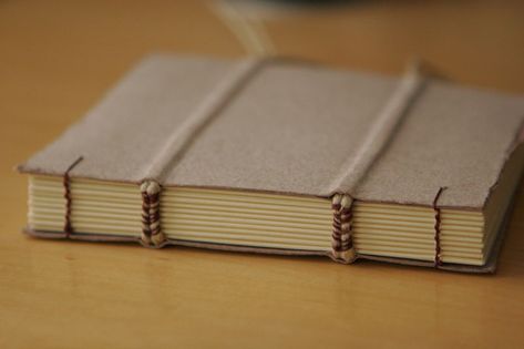 Handmade book with exposed stitching with hemp cord on the spine and through the cover. Bookbinding Techniques, Buku Diy, Binding Ideas, Coptic Binding, Coptic Stitch, Hemp Paper, Bookmaking, Hemp Cord, Handmade Book