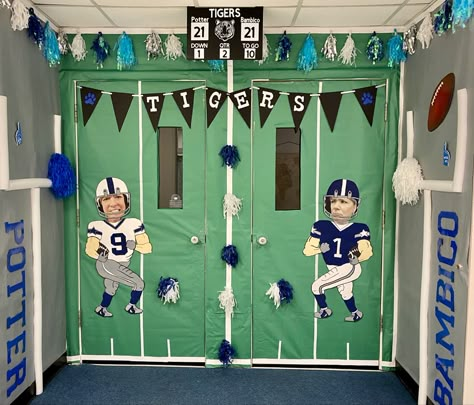 Football theme for our school door this year with pool noodle goal post, trace and paint on paper football players. Scoreboard was made with foam board and cricut cutouts Football Themed Door Decorations, Football Door Decorations For School, Football Themed Classroom Door, School Spirit Hallway Ideas, Football Hallway Decorations, Football Window Display, Pe Door Decorations, Hallway Decorating School Homecoming, School Spirit Door Decorations