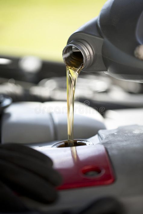 Oil change on a vehicle during its service. Car mechanic pouring fresh oil into , #AFF, #service, #Car, #vehicle, #Oil, #change #ad Oil Change Service, Car Oil Change, Clever Business Cards, Oil Service, Auto Service, Oil Change, Car Mechanic, Creative Ads, Stock Images Free