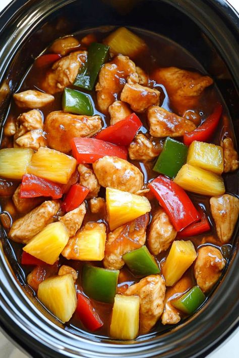 This easy Crockpot sweet and sour chicken is even better than takeout! With just a few key ingredients, you have a dump-and-go meal the family will love. Sweet N Sour Chicken Crock Pot, Slow Cooker Chicken Stir Fry Recipes, Chicken Cubes Crockpot Recipes, Chicken With Sweet And Sour Sauce, Sweet And Sour Chicken Freezer Meal, Crockpot Sweet And Sour Chicken Recipes, Slow Cooker Bbq Pineapple Chicken, Crockpot Firecracker Chicken, Crock Pot Sweet And Sour Chicken