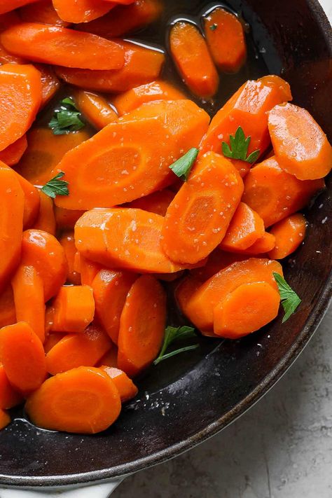 The most delicious Candied Carrot recipe with sweet brown sugar, maple syrup and a touch of bourbon - perfect for any holiday meal! #candiedcarrots #candiedcarrotsrecipe #candiedcarrotsstovetop #candiedcarrotsbrownsugar Easter Sides, Carrot Recipe, Candied Carrots, Holiday Dinner Table, Thanksgiving 2024, Whole Roasted Chicken, Cooked Carrots, Glazed Carrots, Holiday Meal