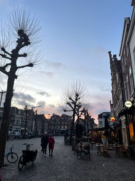 Sunset fading behind the buildings of Harlem city Harlem Netherlands, Netherlands Aesthetic, Pretty Sky, Sky Photography, Photo Dump, Netherlands, The City, Vision Board, Photography