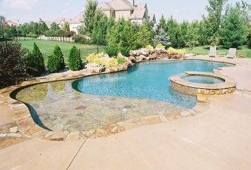 Like the large sun shelf and integration of spa into pool. Flagstone coping nice. Landscaping on backside of pool looks good. Appealing free form design as well. Pool With Flagstone Coping, Pool Shapes With Sun Shelf, Pool Flagstone, Pool Budget, Backyard Grass Landscaping, Pool Spa Design, Organic Pool, Backyard Dining Area, Free Form Pools