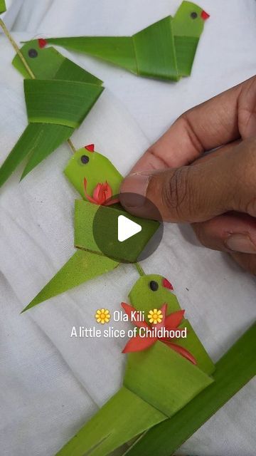 Handcrafted by മനുഷ്യന്‍ 🤗🌺 on Instagram: "Ola kili—those simple coconut leaf parrots we all made as kids. Nostalgic, familiar, yet always special. ☺️🦜❤️
Over the years, I’ve been fortunate to learn intricate patterns using coconut leaves directly from elders, but this simple Ola Kili has always held a special place in my heart☺️
Try it and let’s relive a bit of our childhood together🤍
.
.
.
.
.
.
.
.
.
.
.
.
.
.
.
.
.
.
.
#visualart #malayalam #kerala #keralareels #love #coconutleafcraft #coconutleafdecor #leafdecor #coconutleafparrot #parrot #traditional #nature #floral #floraldesign #floralarrangement #festive" Coconut Leaf Weaving, Diwali Art And Craft, Leaf Activities For Kids, Kids Nature Activities, Parrot Craft, Eco Craft, Leaf Art Diy, Flower Garland Diy, Hand Art Kids