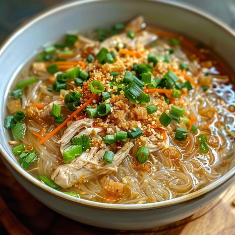 🍲 Enjoy the comforting Chicken Sotanghon Soup! 🥣✨ #ChickenSotanghon #VermicelliSoup Chicken Sotanghon Soup (Chicken Vermicelli Soup) Ingredients: Chicken breast, shredded (1 cup) Sotanghon (vermicelli noodles) (100g) Garlic, minced (3 cloves) Onion, chopped (1) Carrots, julienned (1 cup) Chicken broth (4 cups) Fish sauce (1 tbsp) Salt and pepper to taste Green onions and fried garlic (for garnish) Instructions: Soak sotanghon noodles in water until softened. Drain and set aside. In a pot,... Chicken Soup With Vermicelli Noodles, Sotanghon Soup Filipino Food, Chicken Sotanghon Soup Filipino Food, Sotanghon Soup, Souplantation Chicken Noodle Soup, Chicken Sotanghon Soup, Chicken Vermicelli, Filipino Noodles, Ginger Garlic Chicken Noodle Soup Smitten Kitchen