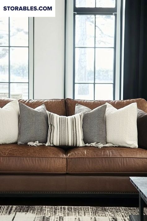 Ready to refresh your brown leather couch? Find out which pillow colors can transform your living room. From soft hues to bold patterns, we’ve got you covered. Which color do you love? 🎨 #CouchLivingRoomIdeas #DecorInspo #LivingRoomStyle #BrownLeatherCouch #Storables Soft Furnishings Living Room, Brown Couch Pillows, Scandi Boho Living Room, Color Pillows, Brown Leather Couch, Colorful Pillow, Brown Couch, Pillow Ideas, Brown Leather Sofa