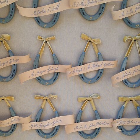 Sometimes the simplest ideas are the most difficult to execute... (This one took a tiny army) We found this pretty ochre velvet ribbon to compliment our blue horse shoes. @bbpaperandink calligraphed the darling banners with guests names and table numbers. I think it was soooo worth it don't you? @lauriearons @santaluciapreserve #carmel #loloandbrian via @angela4design Horseshoe Wedding Decorations, Western Reception, Equestrian Party, Horseshoe Wedding, Edgy Bridal, Wedding Horseshoes, Horse Shoes, Blue Horse, Derby Party