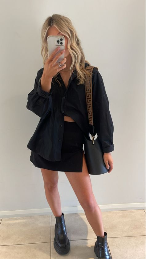 Black mini skirt and overshirt A classic black mini skirt with a button up black shirt Paired back with ALIAS MAE boots and Nim the label bag #chicstyle #miniskirtoutfit #skirtfashion #skirtoutfit #fashion #classic #aliasmae #bootsforwomen #boots #chunkyshoes #skirts #OOTD #ootdfashion #fashionandstyle Black Mini Skirt Street Style, Mini Skirt Outfit Going Out, Black Silk Mini Skirt Outfit, Button Down And Skirt Outfit, Button Up With Skirt Outfit, Black Mini Skirt Outfit Night Classy, Black Skirt Outfit Spring, Button Up Shirt And Skirt Outfit, Black Skirt Outfit Party Night