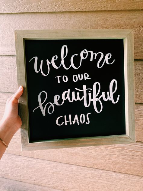 **Welcome to our Beautiful Chaos** Chalkboard sign with a clear finish to protect from moisture. Each sign is made with love and carefully handcrafted to help turn your house into a home. All lettering is hand written by me! Welcome To Our Beautiful Chaos, Beautiful Chaos, Chalkboard Sign, Chalkboard Signs, Hand Written, Hanging Signs, Made With Love, Handwriting, Chalkboard