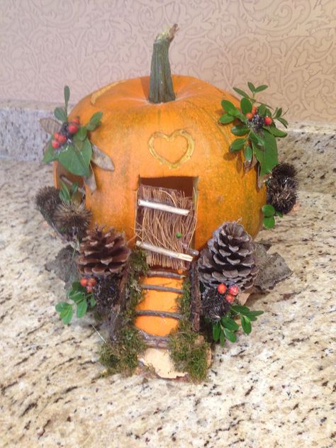 A home for a fairy or little critter carved from pumpkin and decorated with sticks, leaves, moss and odds and ends found in my yard Pumpkin Village, Fairy Garden Pumpkin, Pumpkin Fairy House, Pumpkin Fairy, Creative Pumpkin Decorating, Pumpkin Decorating Contest, Creative Pumpkin Carving, Pumpkin Contest, Pumpkin House