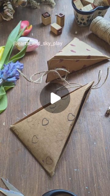 🌿Anna☀️| Crafts, Play & Learning on Instagram: "Paper Triangular Gift Box 🎁  Using a single sheet of A4 Kraft paper I made two Individually decorated gift boxes which are big enough to hold lots of treats or any small gifts 💕  One has been decorated with ink & stamps and the other using our @edding_uk pens.  I thought it would come in handy for Mother's day which isn't too far round the corner!  Get the children involved in decorating the paper and help with the folding to make it a truly personalised gift ❤️  I tried this after seeing it on @giftwrappinglove  #giftwrappingtips #giftwrappingideas #mothersdaygiftideas #giftboxes #diygiftideas #diypapercrafts #papercrafts #papergiftbox #origamigiftbox  #simplecrafts  #recycleandplay #letskeepkidsbusy #childrenscrafts #mothersdaygifts #diy Triangular Box Template, Paper Boxes Diy Folded, Anna Craft, Origami Gift Box, Paper Box Diy, Personalised Gifts Diy, Children's Day Gift, Paper Gift Box, Diy Gift Box