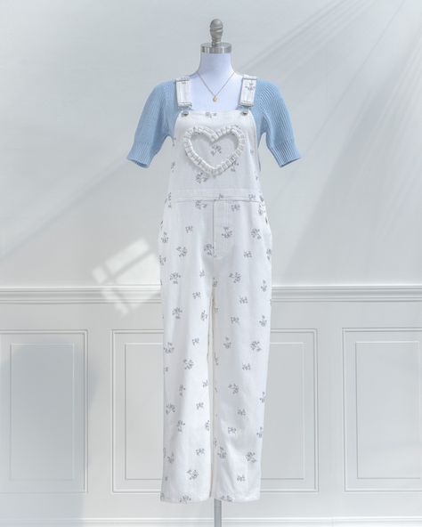 Inspired by the French countryside, the Merryfair Farm jumpsuit pairs vintage farm-girl style with playful feminine details ✨ We love its ruffled heart detail, side and back pockets, adjustable shoulder straps, and sweet blue floral print on white cotton denim 🌻 🏷️ French and vintage inspired clothing, Romantic girl style outfits for spring, Cute jumper outfit inspo, Cottagecore outfits for spring. #amantine #shopsmall Cute Jumper Outfits, Farm Girl Style, Cute Jumpers, Romantic Girl, Cottagecore Outfits, Jumper Outfit, Vintage Inspired Outfits, Farm Girl, Vintage Farm