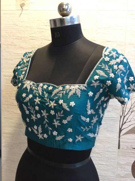 "Teal Radiance: A symphony of elegance in every stitch. This teal blue blouse boasts full kadadana work, delicate cutwork, and scalloped detailing on the neck and waist. 💙✨ #TealElegance #KadadanaMagic" #Pramerasdesign Teal Blue Blouse, Teal Blouse, Cut Work, Blue Blouse, Teal Blue, Stitching, Tapestry, Blue, Quick Saves