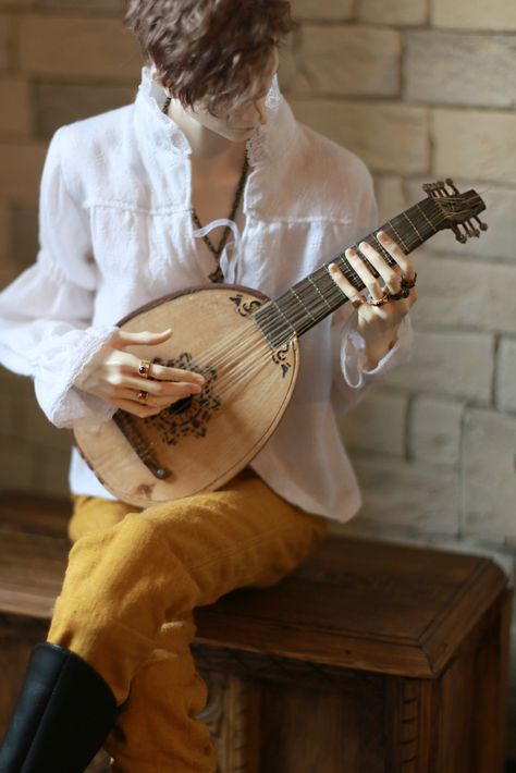 Bard Lute Aesthetic, Person Holding Violin Reference, Small Harp Aesthetic, Medieval Musical Instruments, Person Holding Violin, Playing Lute Pose Reference, Lute Aesthetic, Bard Aesthetic Dnd, Lyre Playing