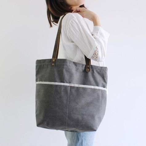 A beautiful large handcrafted canvas tote with plenty of room. A zippered top secures the bag. Perfect for shopping, weekend getaways or a trip to the farmers market. - Long Handle Drop - 2 interior slip pockets - Zippered interior pocket - 17.7 x 15.7 x 4.7 (inches) - Striped cotton lining School Purse, Sew A Bag, Laptop Handbag, Grey Tote, Badass Style, Leather And Canvas, Purse Vintage, Monogram Tote, Huge Sale