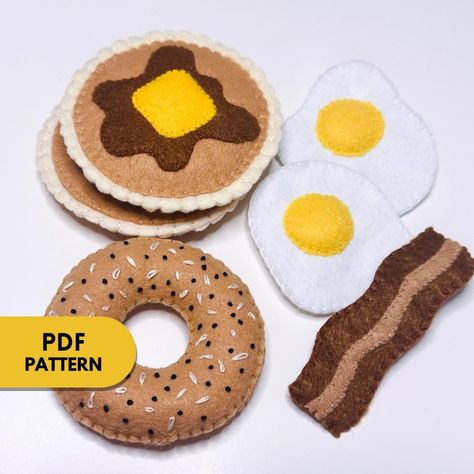 This is a PDF document that includes: A List of Materials Written Step by Step instructions Shape Templates You will learn to create Felt Breakfast Foods. Upon purchase, you will receive an instant download that can be accessed on your Desktop Computer under Purchases on the Etsy Website. Whether you are just learning or an avid sewer, this is a fun project to do year-round! Visit my TikTok page for Video Tutorial Examples https://www.tiktok.com/@annelourayne?is_from_webapp=1&sender_device=pc This tutorial is for personal use only. You may not sell products made from this pattern. Re-sale or distribution of patterns and tutorial , in any form, is strictly prohibited. Fabric Food Patterns, Felt Breakfast Food, Felt Bagel, Felt Crafts Patterns Templates, Felt Food Patterns Free Templates, Free Felt Patterns, Felt Pancakes, Felt Bread, Felt Food Templates