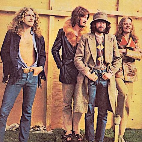 Robert Plant, John Bonham, Jimmy Page, John Paul Jones of Led Zeppelin, Bath Festival on June 28, 1970--how cold could it have been in June? Jimmy even wore that coat & hat onstage. Maybe a style thing, lol. Notice Bonham has slides on, so it couldn't have been too cold.