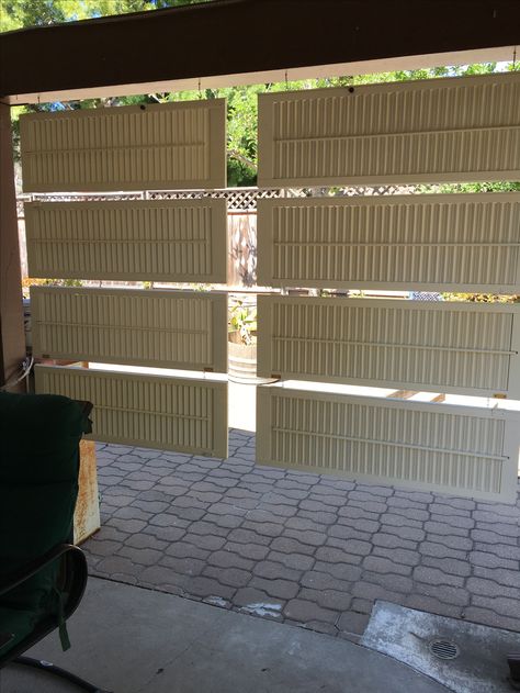 Repurposed old shutters as a privacy screen. Using louvre shutters hanging horizontally and connected together by eyelets and S hooks. Shutter Privacy Screen, Tall Shutters Repurposed, Hanging Privacy Screen Outdoor, Plastic Shutters Repurposed, Shutters Repurposed Outdoors, Upcycle Shutters, Privacy Screen Outdoor Patio, Porch Shutters, Louvre Shutters