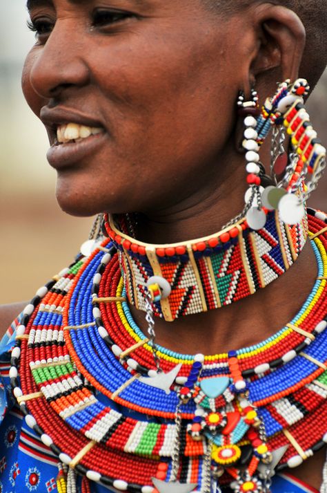 A large number of Masai villages, especially near Masai Mara National Park, have become increasingly commercialized over the past couple of decades, but there are still exceptions like the Masai Village on the edge of Amboseli National Park (next to Kilima Safari Camp). Beads Christmas Tree, Necklace Meaning, Masai Jewelry, African Image, Safari Camp, Beads Christmas, Kenya Travel, Traditional Ornaments, Village Shop