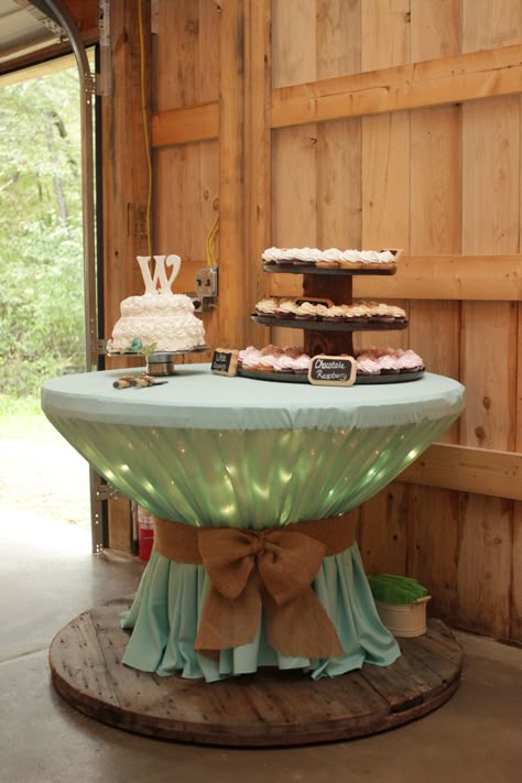 Wooden spool with icicle lights covered with round table cloth. Used a bungee cord to bunch table cloth then covered by burlap. Spool Tables, Music Wedding, Rustic Wedding Decorations, Deco Champetre, Wedding Dessert Table, Wooden Spools, Makeup Salon, Wedding Desserts, Rustic Wedding Decor