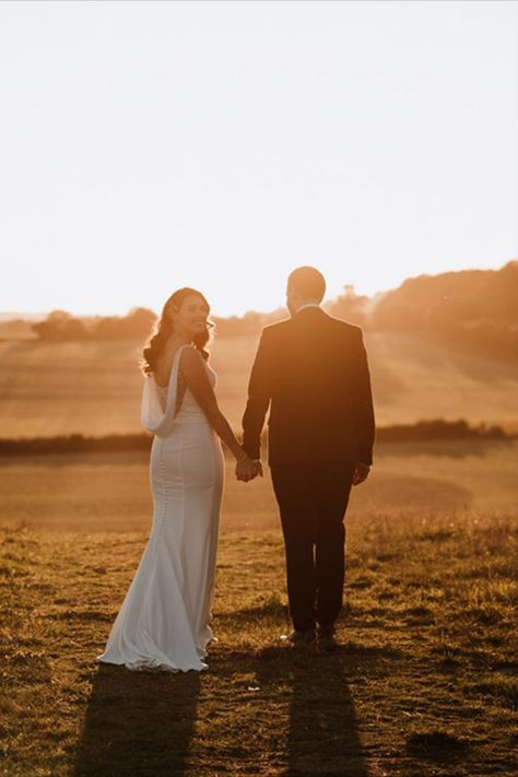 Golden hour couple portrait with the bride in a cowl back wedding dress and groom in a navy suit admiring the views in Kent Wedding Walk, Golden Hour Wedding, Sunset Wedding Photos, Wedding Photography Ideas, Golden Hour Photos, Golden Hour Photography, Yosemite Wedding, Wedding Details Photography, Back Wedding Dress