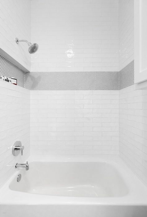 stripe tile design in bathroom Shower With Stripe Of Tile, Penny Tile Accent Stripe, 3x5 Tile Shower Ideas, White Subway Tile Bathroom Half Wall, Penny Tile Shower Accent, Penny Tile Stripe Bathroom, Wavy White Subway Tile Bathroom, Accent Stripe On Shower Wall, White Subway Tile Shower With Accent