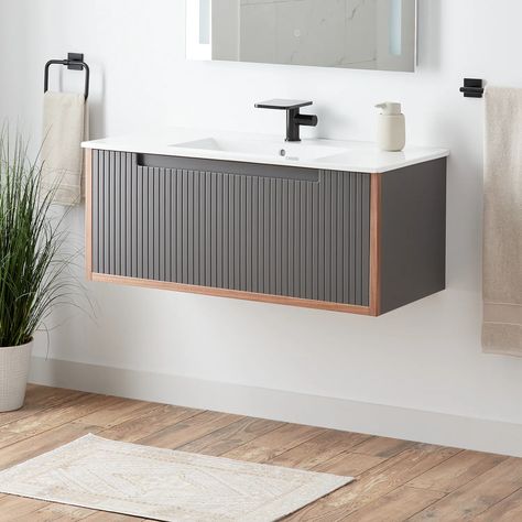 Elevate your bathroom while conserving space with the 40" Bisbee Wall-Mount Vanity. Finished in muted gray, warm oak framing creates a timeless color combination that complements a variety of styles. Modern, fluted detailing adorns the front of the vanity Pedestal Tub, Corner Toilet, Floating Bathroom Vanities, Soft Close Drawer Slides, Console Sink, Acrylic Cabinets, Single Sink Vanity, Single Handle Kitchen Faucet, White Sink